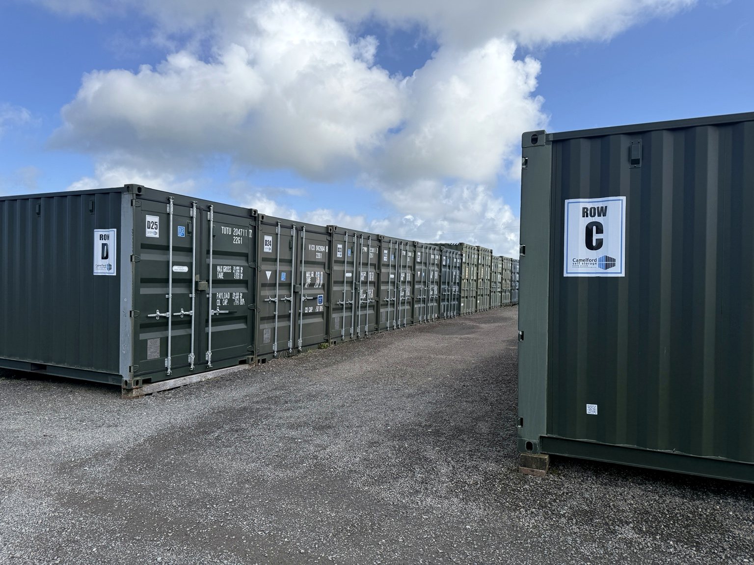 Rows of storage containers and vehicle access at Camelford Self Storage in Tregath Business Park